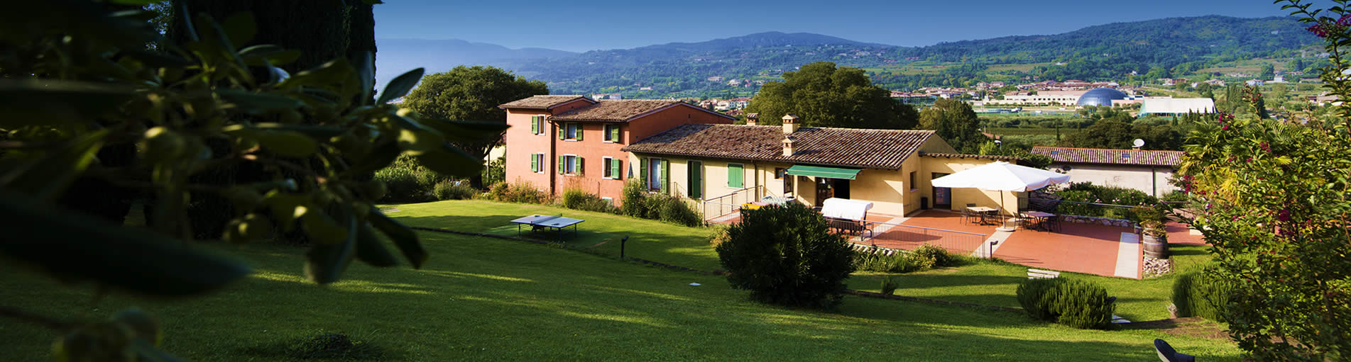 The houses and terrace of the residence at golden hour